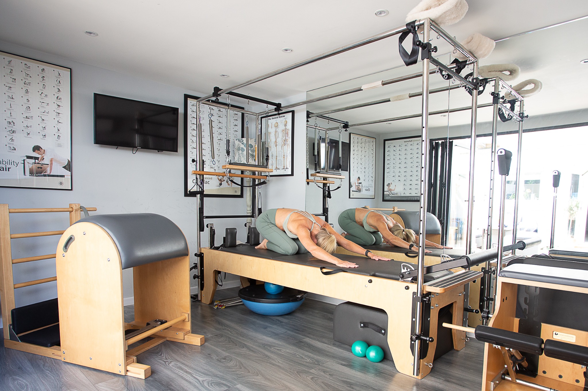 Calm controlled Pilates movement in the Balanced Wellness studio